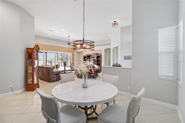 dining space featuring ceiling fan, recessed lighting, light tile patterned flooring, and baseboards