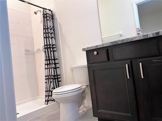 full bath featuring tile patterned flooring, a shower stall, toilet, and vanity