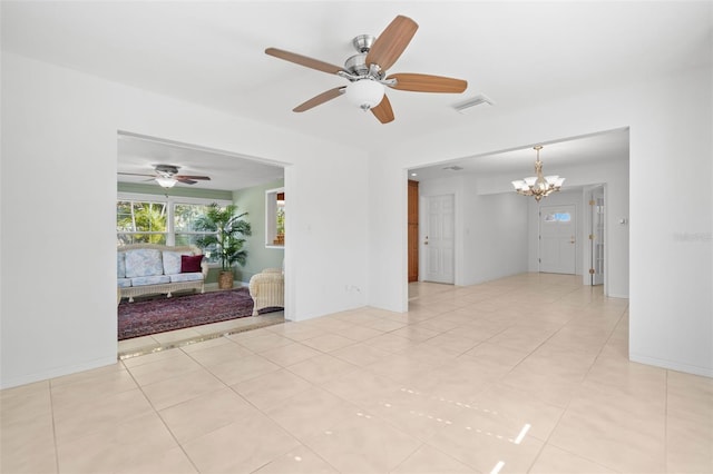 empty room featuring a chandelier, visible vents, and light tile patterned flooring