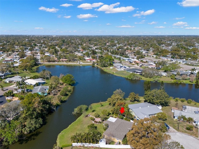 drone / aerial view with a residential view and a water view