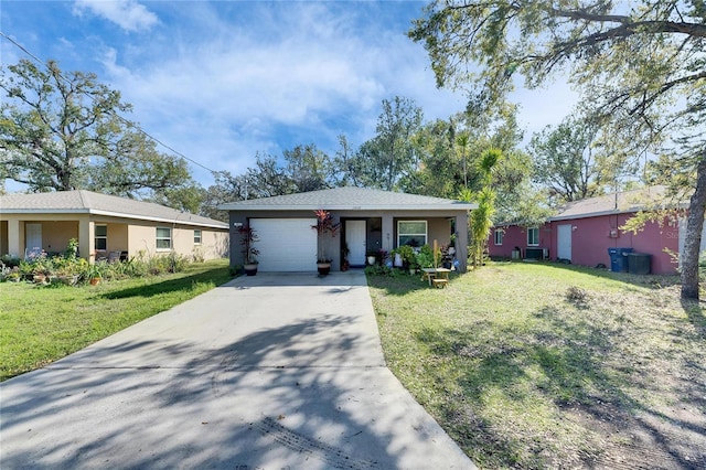 ranch-style house with stucco siding, central AC unit, a front yard, a garage, and driveway