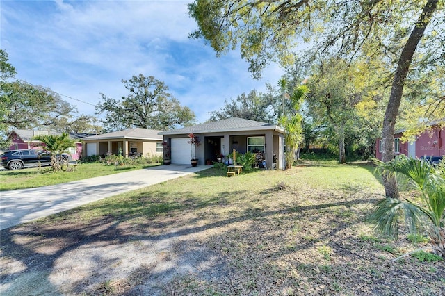 bungalow-style home featuring a front lawn, driveway, and an attached garage