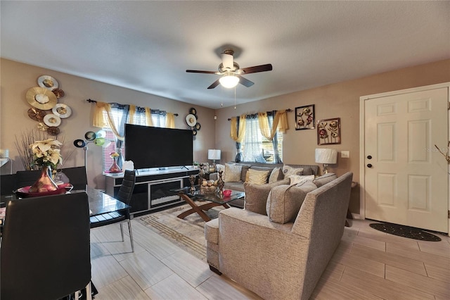 living area featuring ceiling fan