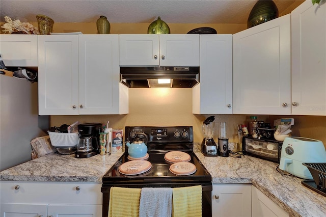 kitchen with light stone counters, black range with electric stovetop, white cabinetry, and under cabinet range hood