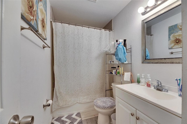 bathroom featuring toilet, a shower with shower curtain, and vanity