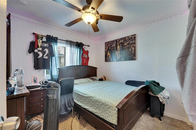 bedroom featuring light carpet, ceiling fan, and baseboards