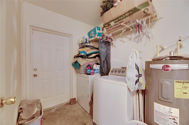 clothes washing area with laundry area, water heater, and washing machine and clothes dryer