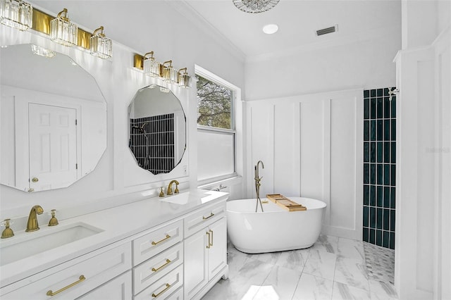 bathroom with a sink, visible vents, crown molding, and a freestanding tub