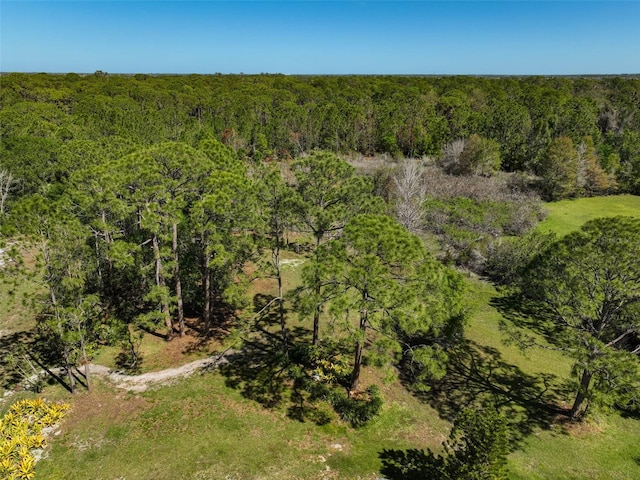 bird's eye view featuring a forest view