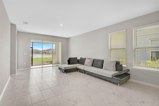 living room featuring recessed lighting, visible vents, marble finish floor, and baseboards