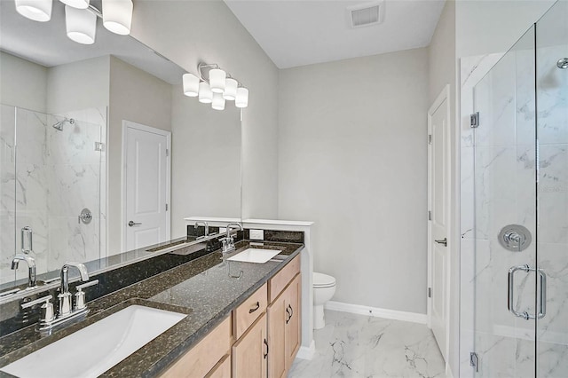 bathroom featuring visible vents, marble finish floor, a stall shower, and a sink