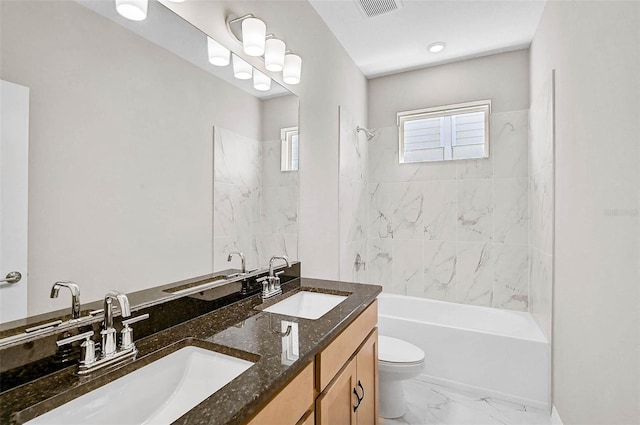 bathroom featuring visible vents, marble finish floor, and a sink