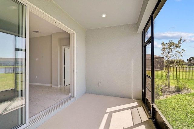 unfurnished sunroom with visible vents