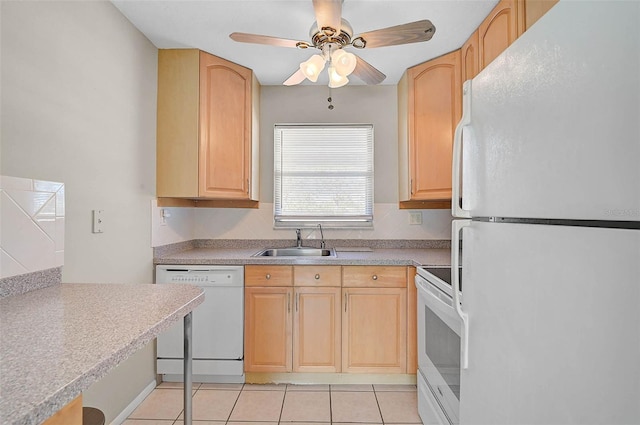 kitchen with white appliances, light tile patterned floors, light brown cabinetry, and a sink