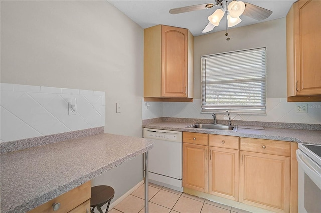 kitchen with white appliances, light tile patterned flooring, ceiling fan, light brown cabinetry, and a sink