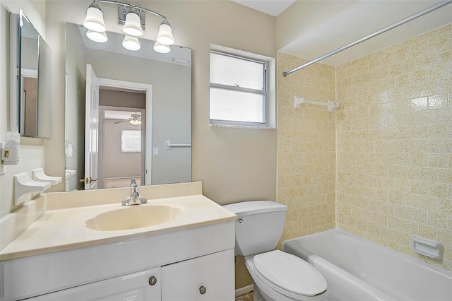 bathroom with vanity, shower / tub combination, and toilet