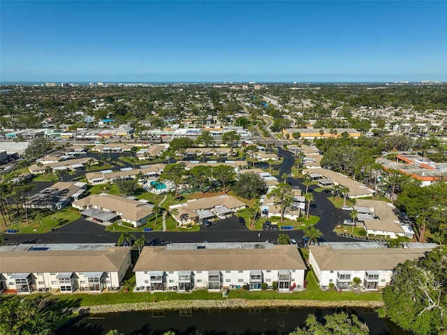 birds eye view of property with a residential view and a water view