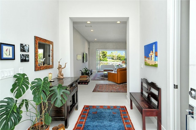 corridor with recessed lighting and tile patterned floors