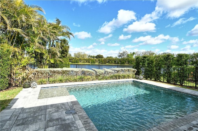 view of swimming pool with a water view, fence, a fenced in pool, and a patio