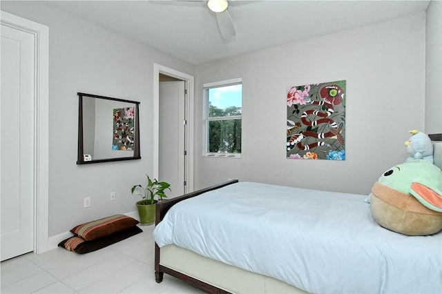 bedroom featuring ceiling fan and tile patterned floors