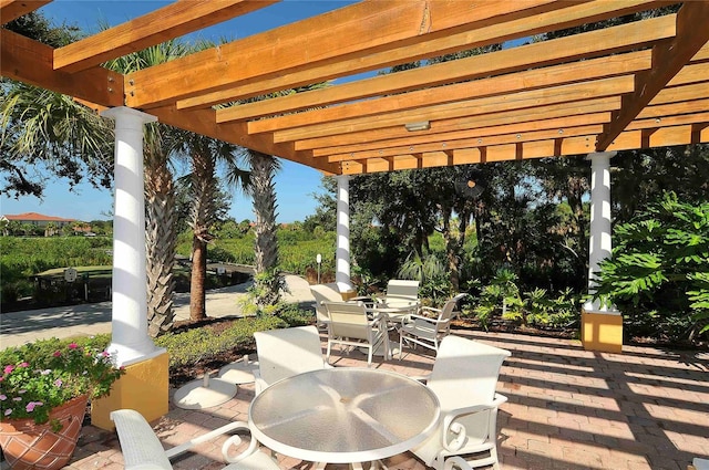 view of patio / terrace with outdoor dining space and a pergola