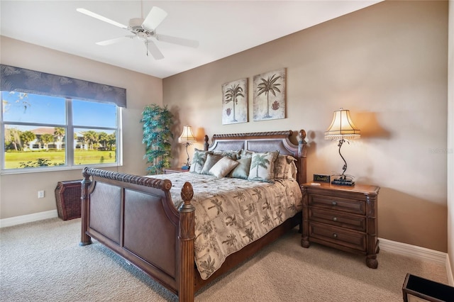 bedroom with carpet flooring, a ceiling fan, and baseboards