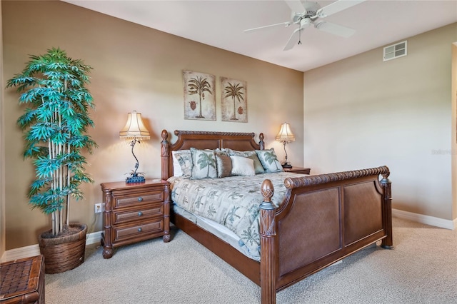 bedroom featuring light carpet, visible vents, a ceiling fan, and baseboards