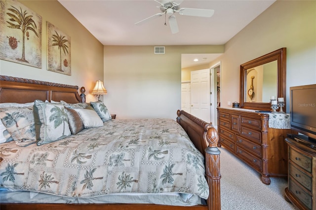 bedroom with visible vents, carpet floors, and ceiling fan