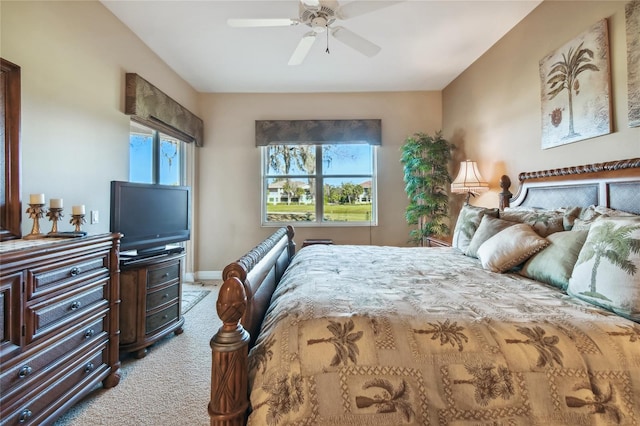 bedroom with baseboards, light carpet, and a ceiling fan