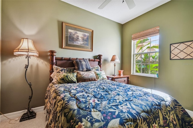 carpeted bedroom featuring ceiling fan and baseboards