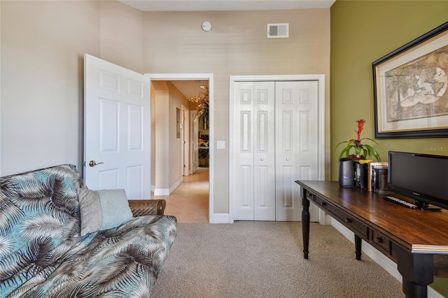 office with light colored carpet, visible vents, and baseboards