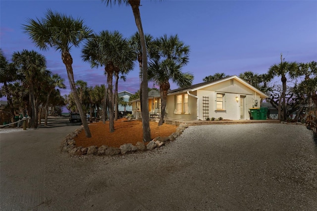 view of front of home with driveway and stucco siding