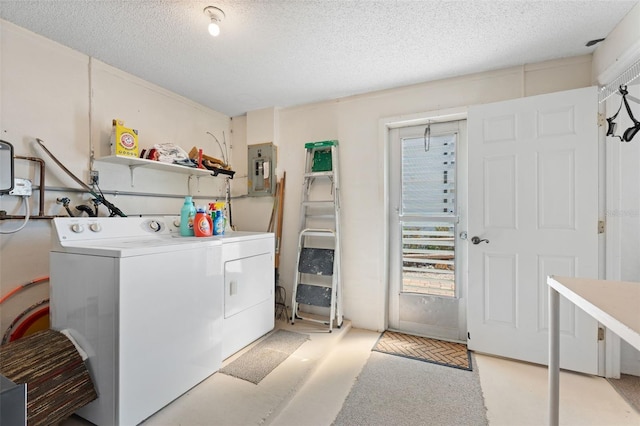 laundry room with a textured ceiling, light carpet, laundry area, electric panel, and washing machine and clothes dryer