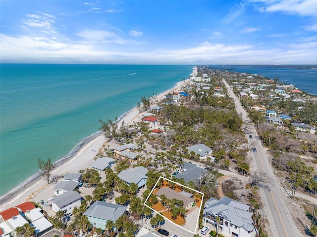 drone / aerial view featuring a water view and a residential view