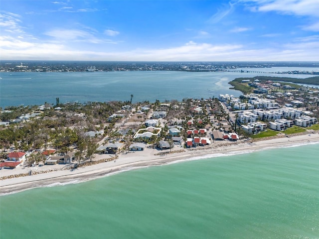 bird's eye view with a beach view and a water view