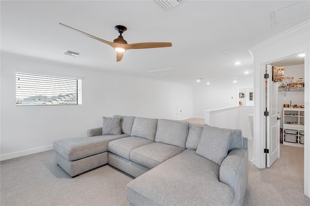 living room featuring light colored carpet, visible vents, and baseboards