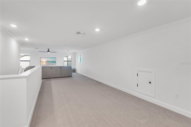 spare room featuring a healthy amount of sunlight, baseboards, and ornamental molding