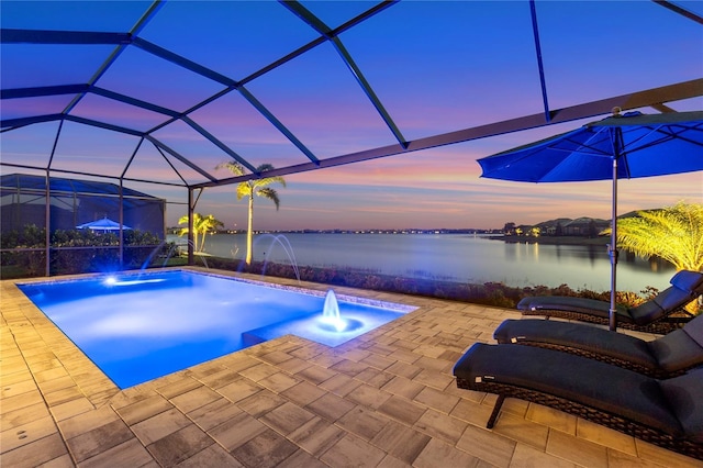 outdoor pool featuring a water view, a lanai, and a patio