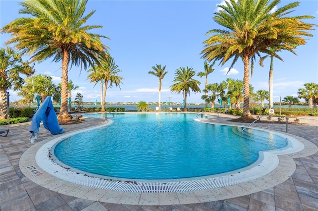 community pool with a patio area