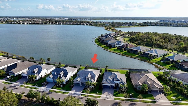 aerial view featuring a residential view and a water view