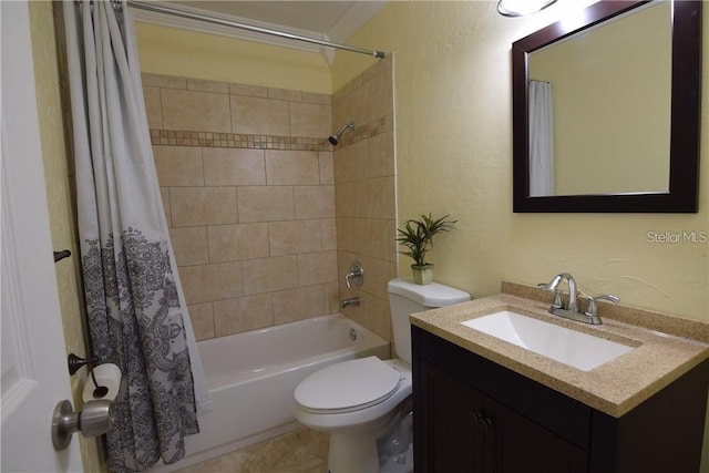 bathroom featuring toilet, a textured wall, shower / bath combo with shower curtain, and vanity