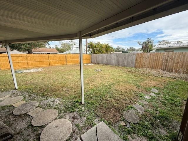 view of yard with a fenced backyard