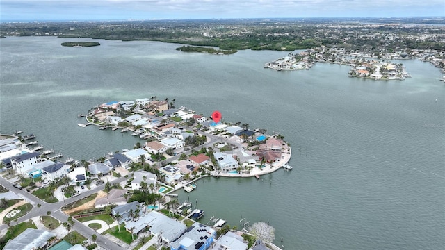 drone / aerial view featuring a water view and a residential view