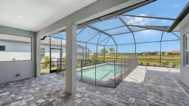 outdoor pool featuring a patio and a lanai