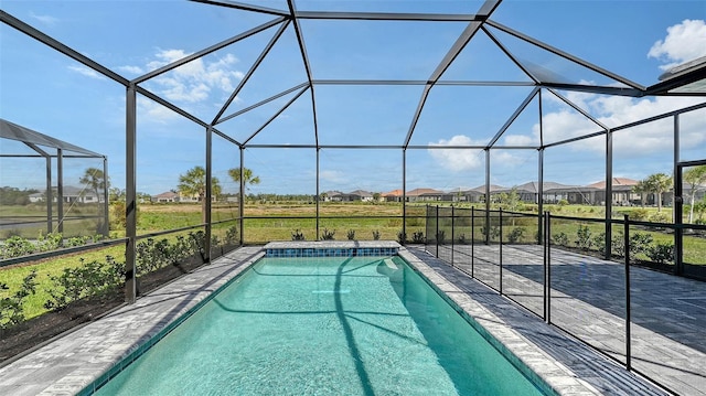 outdoor pool with a patio and a lanai