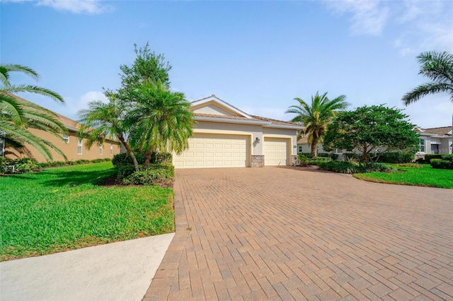 view of front of property with an attached garage, decorative driveway, and stucco siding