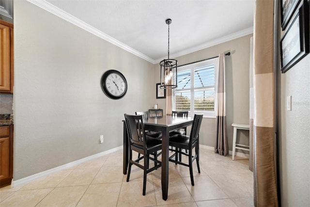 dining area with a chandelier, crown molding, baseboards, and light tile patterned floors