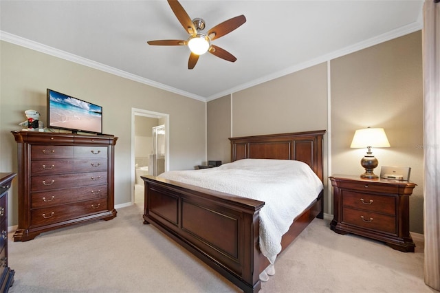 bedroom featuring light carpet, ceiling fan, connected bathroom, and crown molding