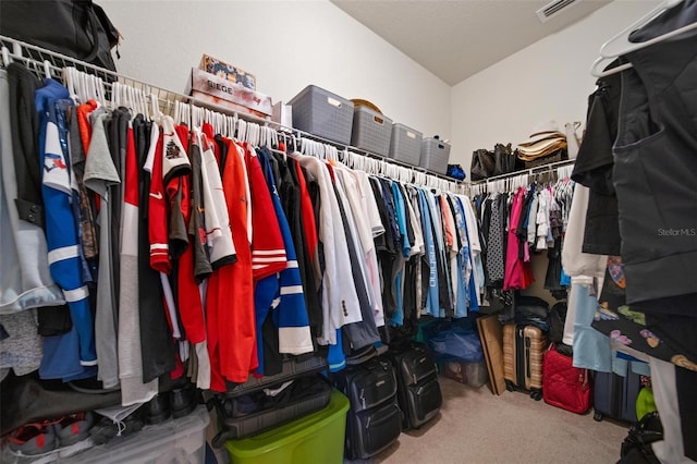 spacious closet with carpet floors and visible vents