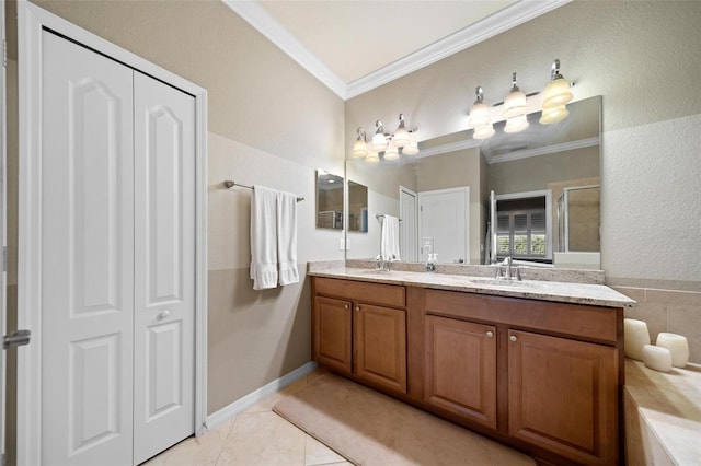 bathroom featuring double vanity, ornamental molding, tile patterned flooring, and a sink